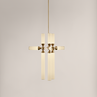 Modern gold pendant light fixture on a neutral background
