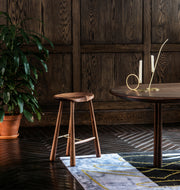 Taper Counter Stool (Black walnut) — Roll & Hill Showroom, New York City. Image by Max Burkhalter